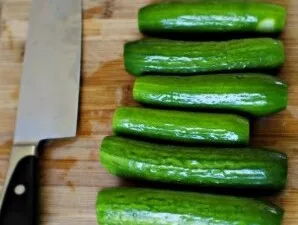 Wash the cucumbers and cut off the ends.