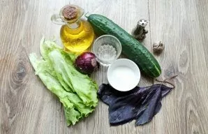 Gather all the ingredients needed for the Cucumber Basil Salad.