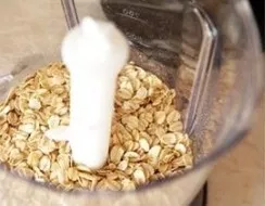 Grind oatmeal with a blender.