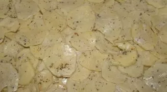 Line the baking sheet with foil and grease with oil. On a baking sheet we lay out slices of thinly chopped potatoes, sprinkle with our fa...