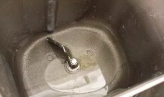 Pour oil and water into a bowl.
