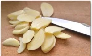Peel the garlic and cut it in half, removing the core.