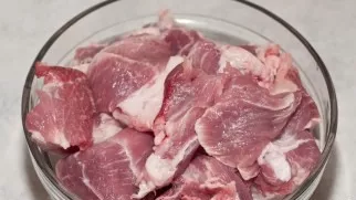Cut the pork neck into bite-sized pieces.