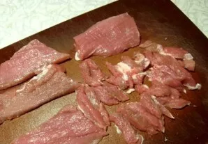 We wash the pork under cold water and dry it, this can be done with a paper napkin, the meat is slightly whipped. Then we cut it, and cut...