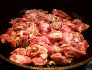 First you need to wash the meat, wipe the films (if any) and cut into small pieces. Pour a little vegetable oil into the pan and put the ...