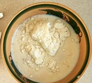 First, knead the dough. To do this, dilute the yeast in a heated glass of milk (150 ml). Let it stand for 10-25 minutes. Then add some fl...