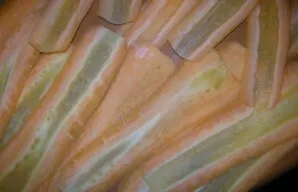 I peel and wash the carrots, then cut them into thin layers with a vegetable peeler. I cut the chicken into pieces and fry it in a pan, a...