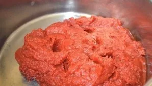 Transfer any tomato paste to the pan where you will cook.