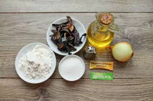 Prepare all the necessary ingredients for making pies with dried mushrooms.