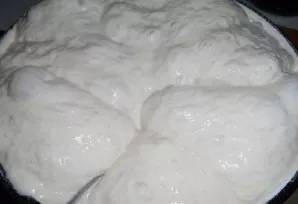 Making dough. Pour milk, yeast, salt and sugar into the flour (leave 1-1.5 glasses to form cakes). We knead the dough. Should be like thi...