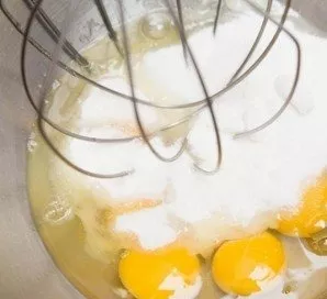 Heat the oven to 180 degrees. Beat the eggs with sugar and almond extract, the mass should triple.