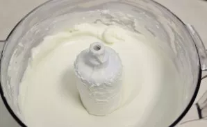 With a food processor or mixer, crush the cream cheese and sour cream until smooth.