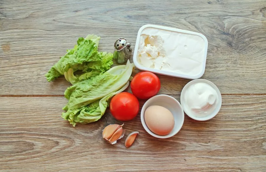 Gather all the necessary ingredients to prepare the salad. Hard boil the egg over medium heat and set aside.