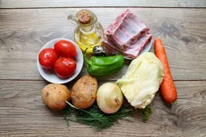 Prepare the ingredients. Wash the ribs, cut into segments between the bones. Pour water into a saucepan, put the ribs and cook over low h...