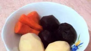 Wash carrots, beets and potatoes. Boil until tender, or steam. Then cool the vegetables and peel them.