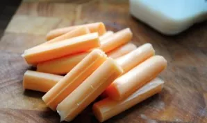 Peel the cheese sticks from the wrapper.
