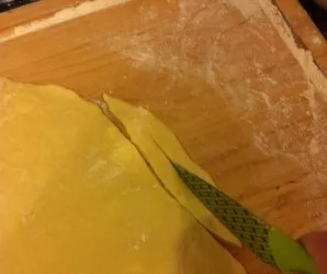 Pour milk into a bowl, beat eggs, add sour cream, granulated sugar, salt and vodka, mix. Sift the flour and knead the dough. Divide the d...