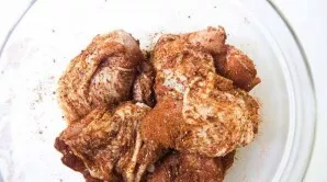 Mix spices: bell pepper, salt, ground black pepper, garlic powder, oregano. Rinse and dry the meat, then put in a bowl and add spices. If...