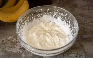 Pour 120 ml. of heavy cream into a spacious bowl and beat with a mixer until creamy.