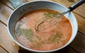 Pour the tomato mixture into the pan with fried onions and flour, add 1 teaspoon of salt and spices. Next, simmer everything together ove...