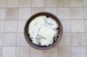 We pour white sauce on top.