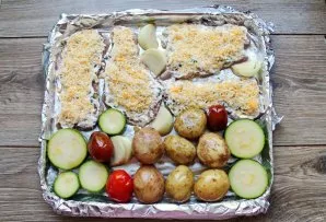 Spread the vegetables on a baking sheet along with the meat, grease them with another vegetable oil.