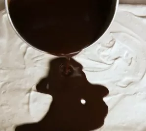 Cool the resulting chocolate mixture to room temperature and then spread it evenly over the at least slightly hardened white mass in our ...