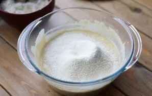 Now sift the flour in parts and first stir in with a spoon, and then with your hands. Flour may be needed a little more or less than indi...