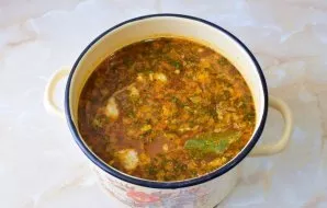 Cook everything together for another 7-10 minutes. At the end of cooking, add chopped walnuts and garlic, squeezed through a press. Add s...