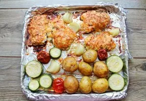 Place a baking sheet with meat and vegetables in a hot oven and bake for 45-55 minutes at a temperature of 180 degrees until cooked. Remo...