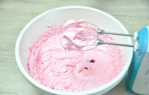 Beat the marshmallow mixture until it becomes very fluffy and begins to thicken, and the whisk of the mixer does not leave clear relief m...
