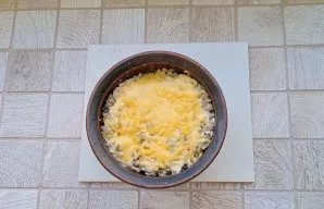 Bake the mushrooms in the oven for 10-12 minutes until the cheese melts.