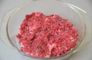 Roll the pork chops in the cranberry marinade and let marinate for 1 hour.