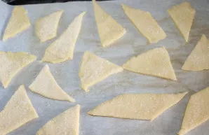 Dip each piece in sugar and place on a baking sheet lined with baking paper.