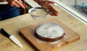 If desired, sprinkle the chocolate cake frosting with a little powdered sugar. Delicious!