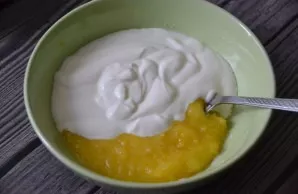 Add sour cream to the yolks.