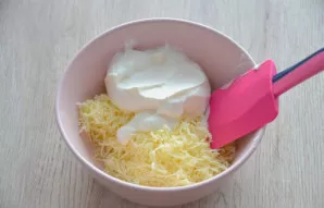 Mix half of the cheese and sour cream (or sour cream).