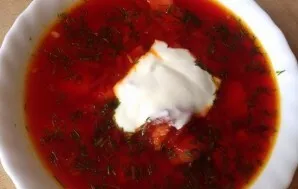 When serving, put fresh herbs and sour cream on plates.