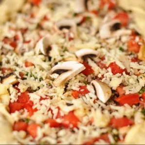 I added mushrooms and chili peppers to the second one. Bake the pizza for 25 minutes until golden brown.