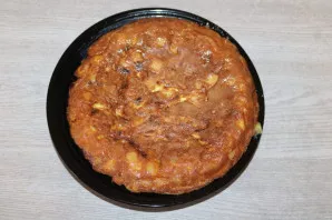 Turn the pan over on a plate. Tortilla must be turned over.