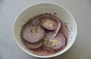 While the pork is cooking, you can marinate red onions in a marinade of water, salt, vinegar, granulated sugar and basil for serving.
