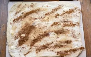 Sprinkle ground cinnamon and brown sugar evenly on top.
