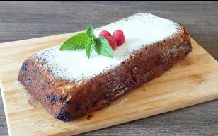 Sprinkle powdered sugar over the cooled cake and serve.