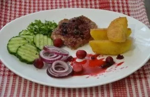 Serve pork with vegetables, parsley, lingonberry sauce will do.