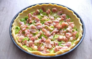 Place the bacon on top of the onion.