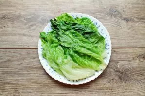 Separate the six leaves from the aisberg lettuce and wash it. Pour water into a saucepan and bring to a boil. Place each sheet in turn fo...