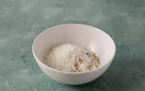 Mix rice flour with starch, sugar, salt, sesame seeds and coconut chips.