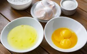 Carefully divide the eggs into yolks, and the whites into separate clean and dry bowls.