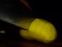 Cut the potatoes, but do not cut them to the end. Make about 1cm spacing between the notches.