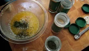 Remove the bowl from the microwave and add garlic powder, dried dill, dried oregano, dried basil and a pinch of cayenne pepper to the but...